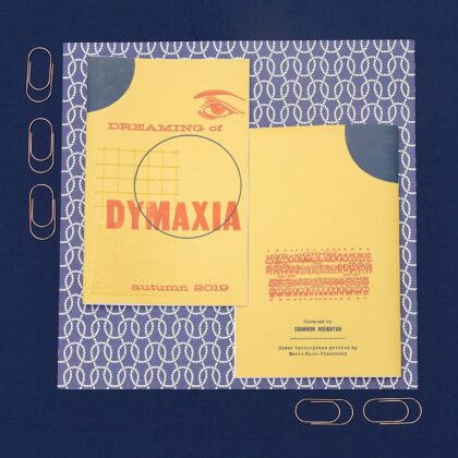 front and back cover of Dreaming of Dymaxia zine, with nautical background and decorative paperclips